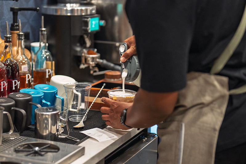 Barista crafting a drink at Randy's Coffee Cafe