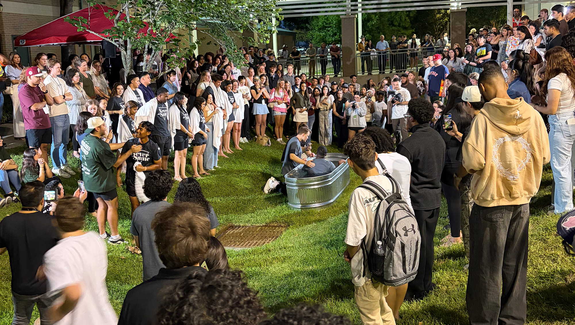 Believer's baptisms at The Grove, Champion Forest young adults gathering