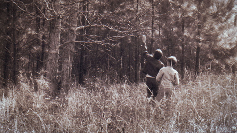 Pastor Robin Guess and his wife Janie walk the original Champion Forest property.