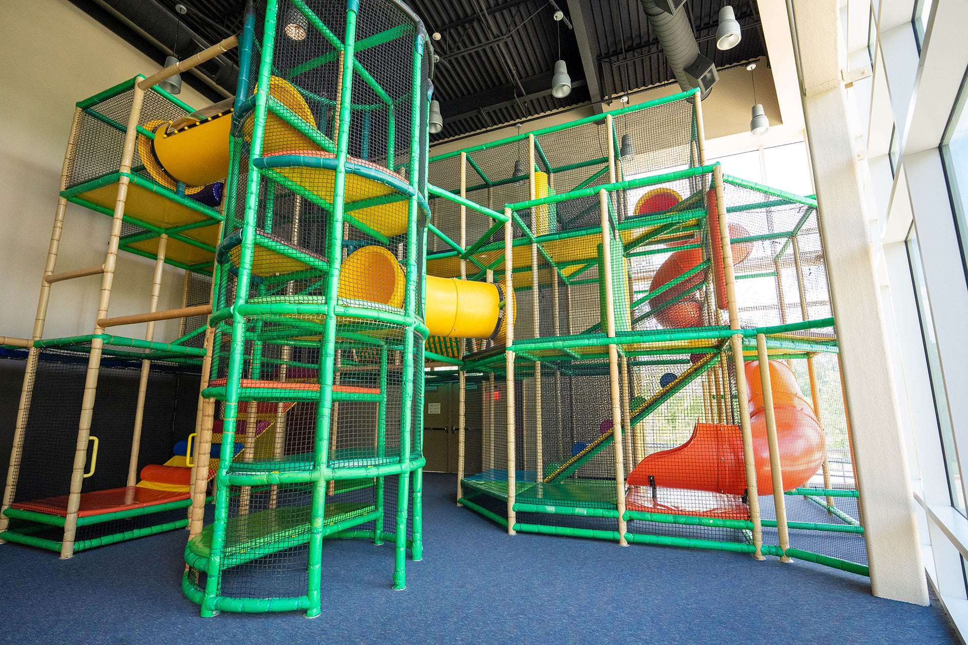 Children playing on the indoor playground at the Champions Campus