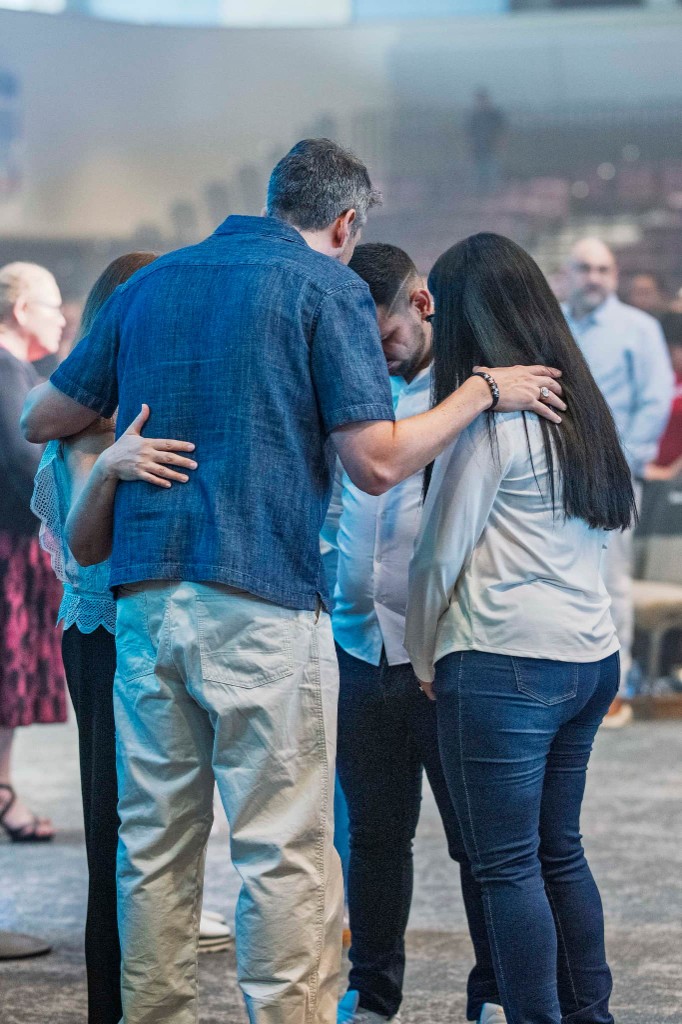 People praying together during a worship service